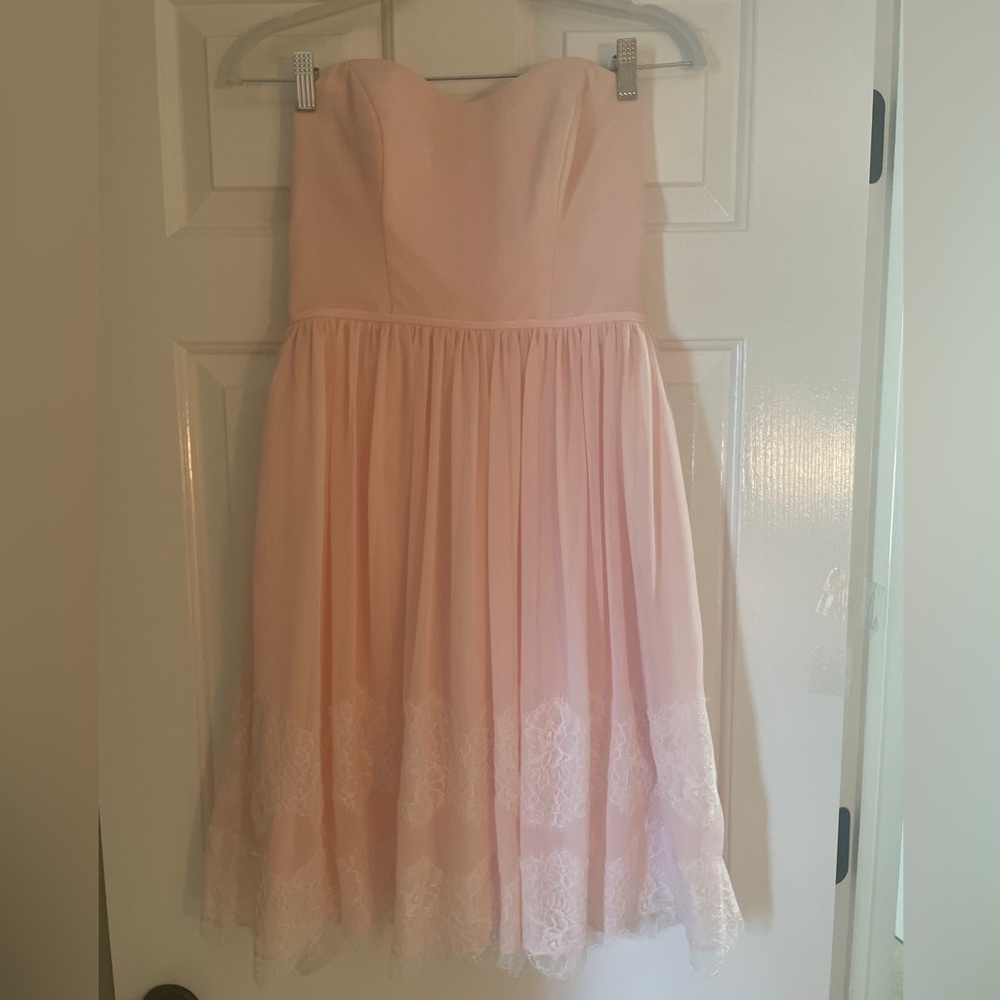 Petal pink strapless dress. Worn once for a wedding. Pretty lace detailing.